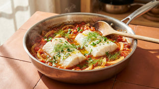 Ling fillets poached in a pan of tomato and fennel with parsley